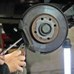 image of a heavy truck brake being worked on in a shop